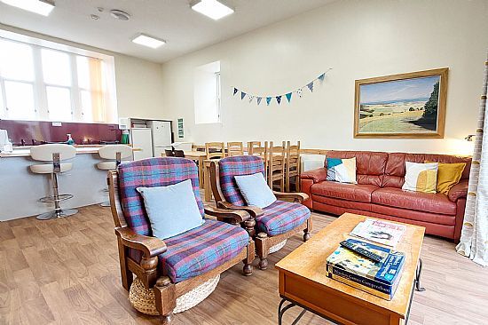 Sitting room with sofas and armchairs